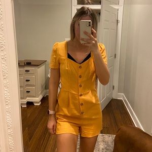 Yellow button up romper
